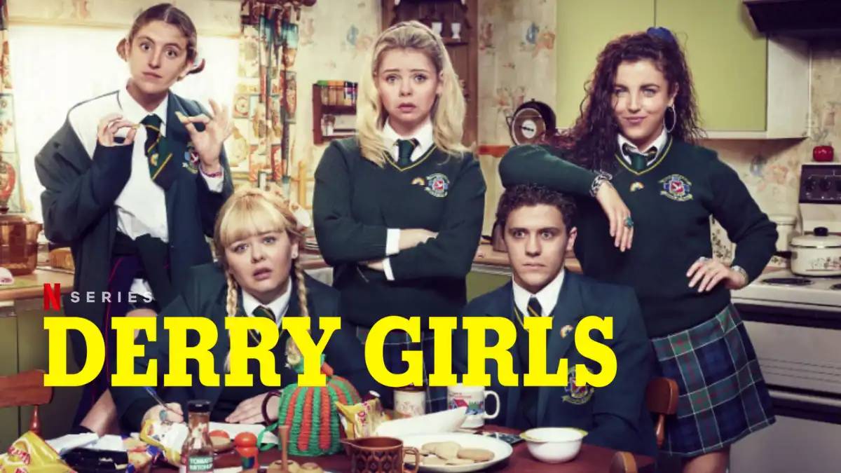 Promotional image for the TV series Derry Girls featuring a group of teenagers in school uniforms posing in a kitchen.